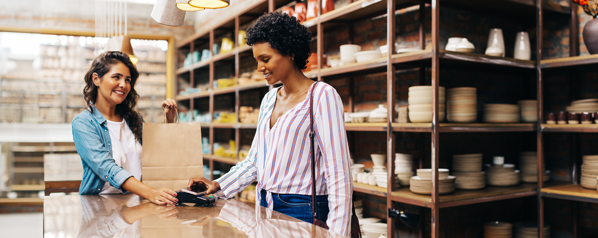 A business owner standing confidently in their shop, ready to welcome travelers who are already a genuine match